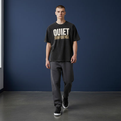 Omina black mineral wash waffle knit t-shirt with "QUIET CONFIDENCE" graphic print. Relaxed fit, crew neck.
