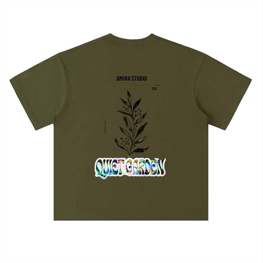 Omina Studio olive green heavyweight cotton t-shirt with drop shoulders and a graphic print of a plant and "Quiet Garden" text.