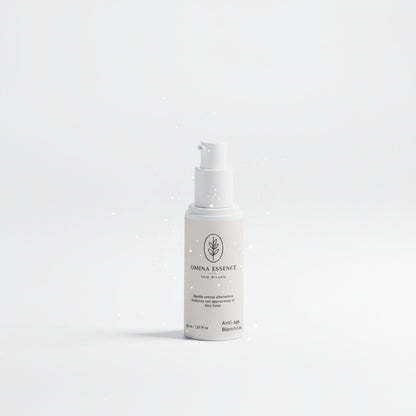Omina Essence Retinol Alternative Serum in a white pump bottle, featuring a label with botanical graphics and text for anti-aging and fine line reduction.