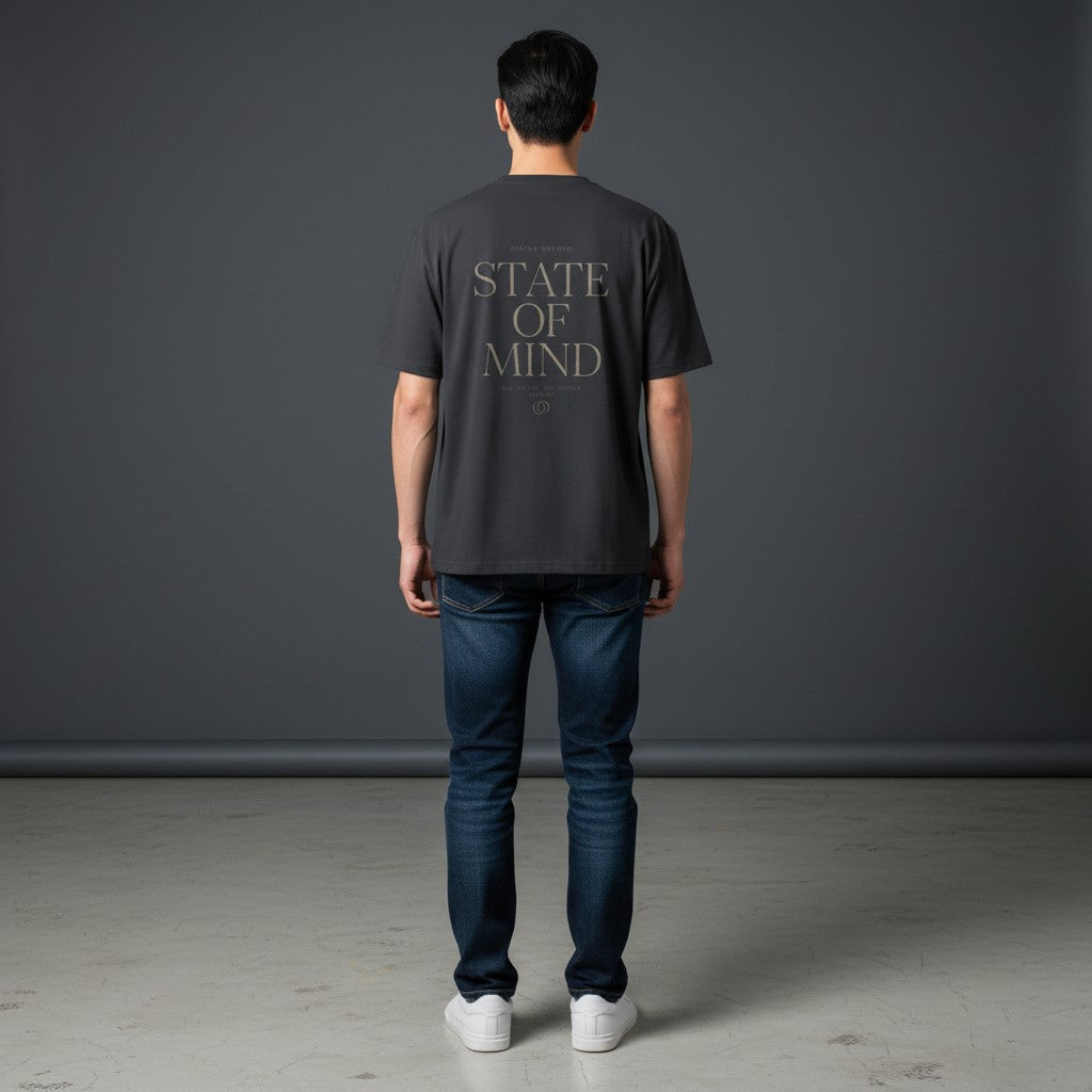 Omina Studio dark grey cotton blend t-shirt with "STATE OF MIND" graphic print on back.