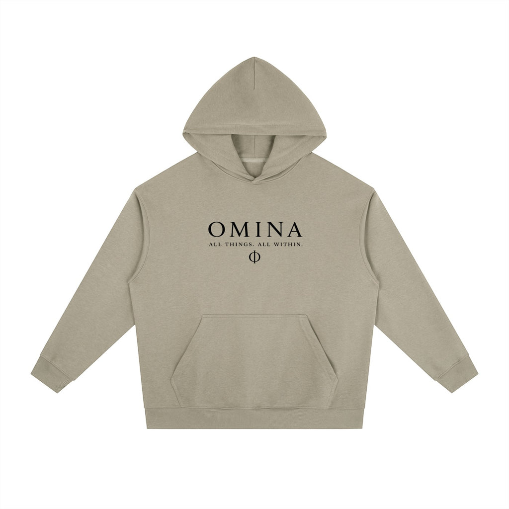 Omina Studio beige heavyweight fleece hoodie with drop shoulders and front pocket. Features black text logo.