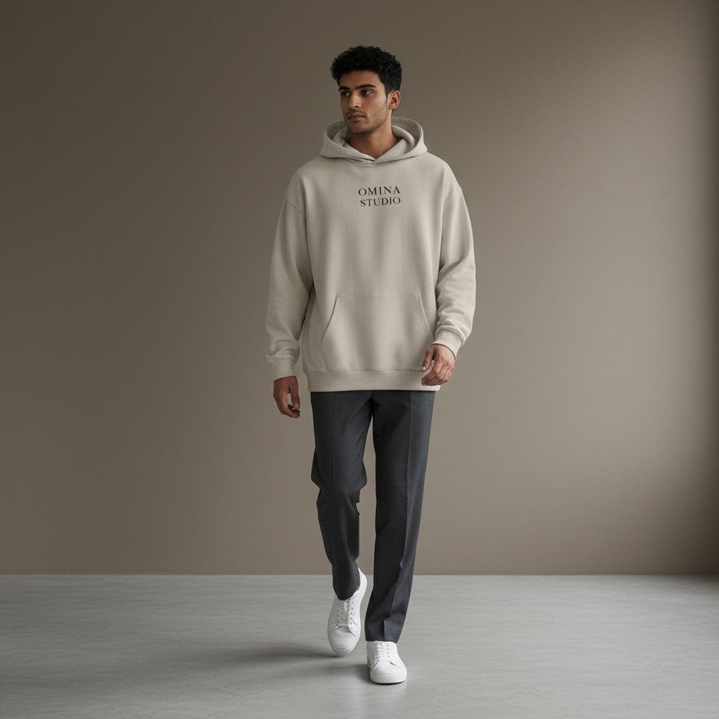 Omina Studio beige heavyweight cotton hoodie with relaxed oversized fit and front pocket.