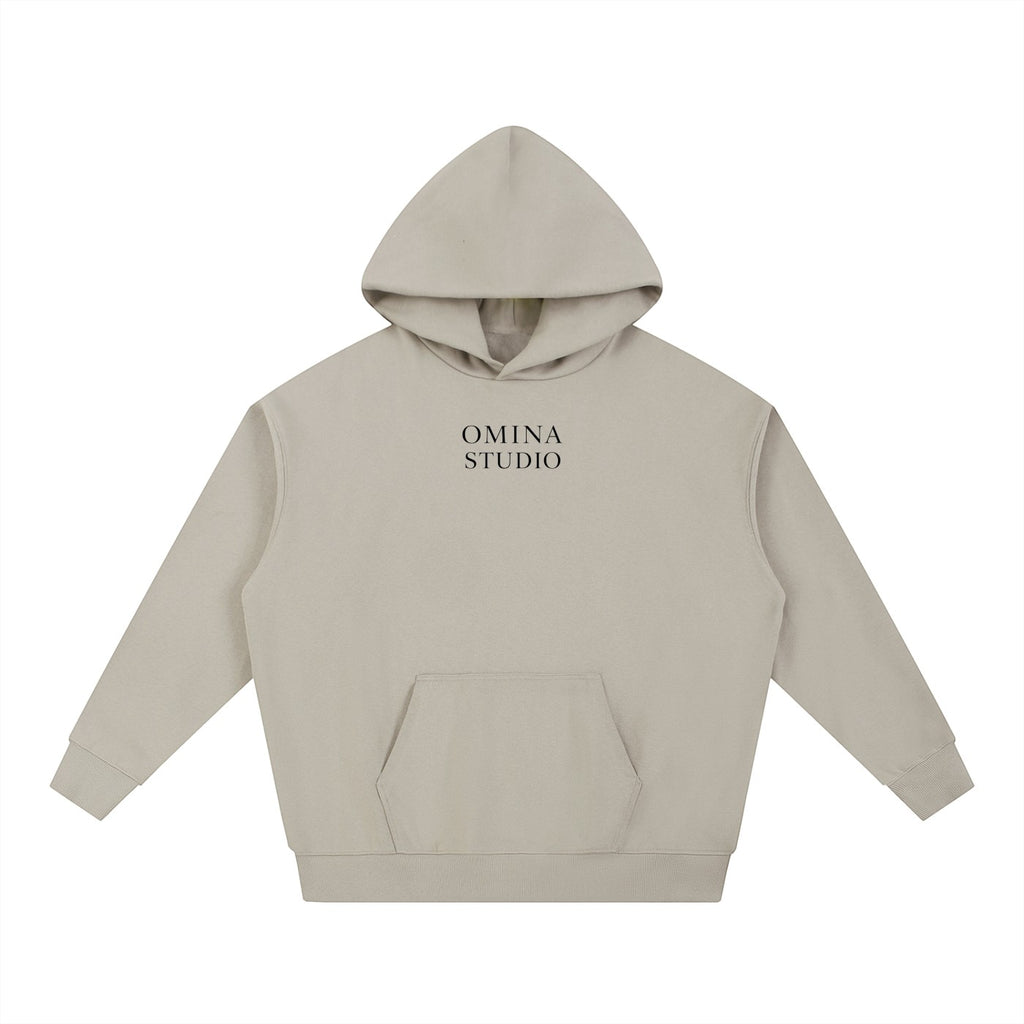 Omina Studio beige heavyweight cotton hoodie with relaxed oversized fit and front pocket. Minimalist design.