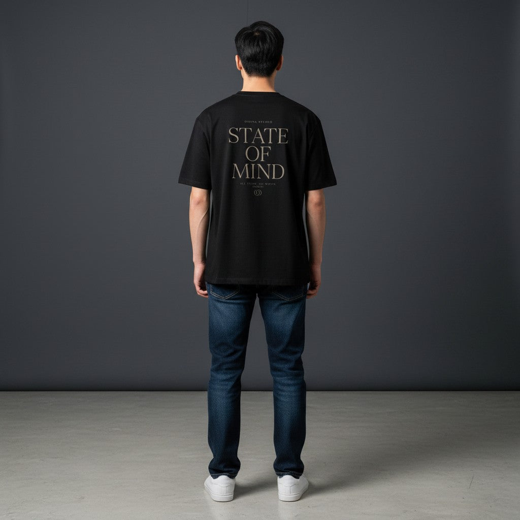 Omina Studio black cotton blend t-shirt with "STATE OF MIND" graphic print on back.