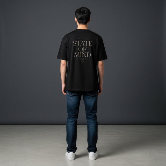 Omina Studio black cotton blend t-shirt with "STATE OF MIND" graphic print on back.