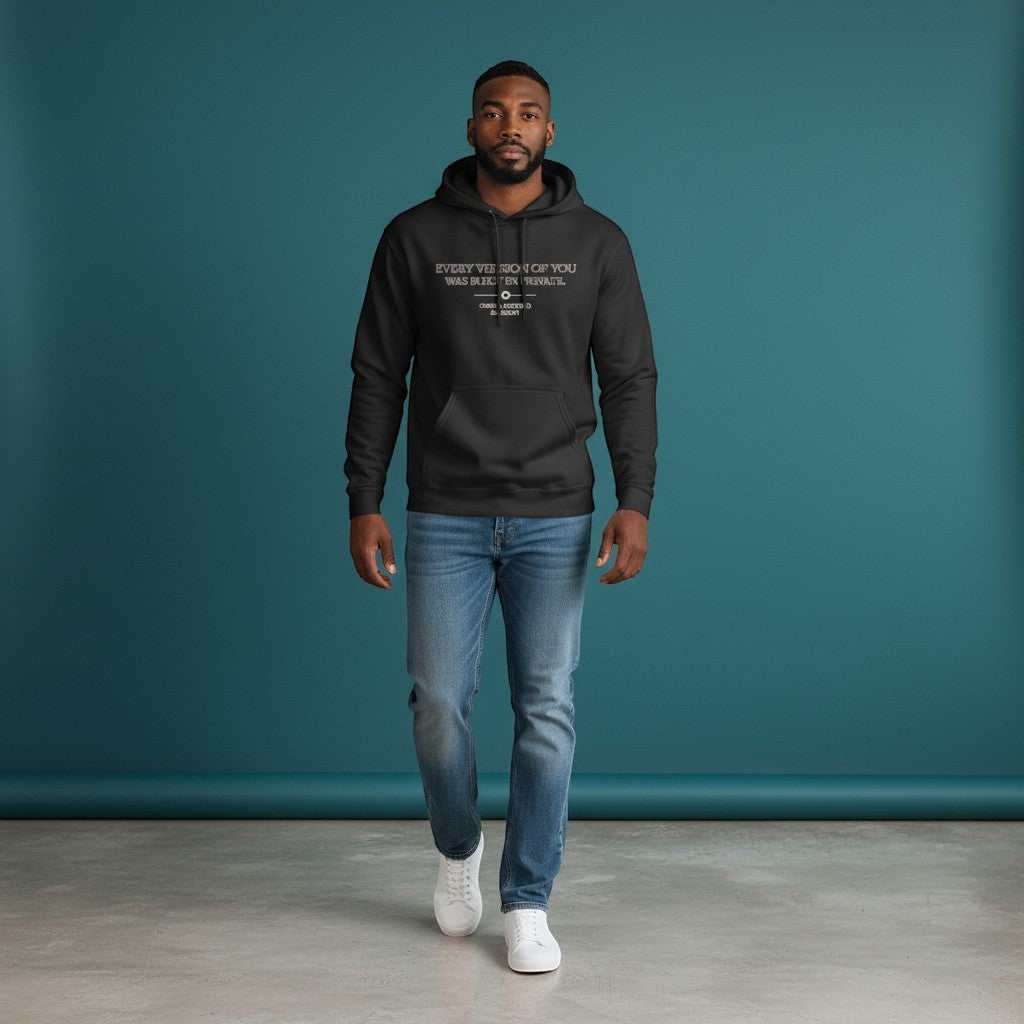 Omina Studio black heavyweight cotton oversized hoodie with "Every Version of You Was Built In Private" graphic.