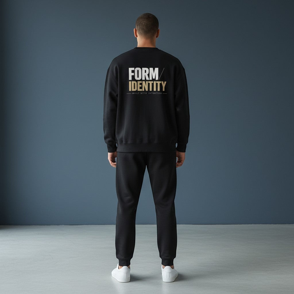 OMINA Studio black heavyweight cotton sweatshirt with oversized fit and brushed interior. Features drop shoulders and ribbed details.