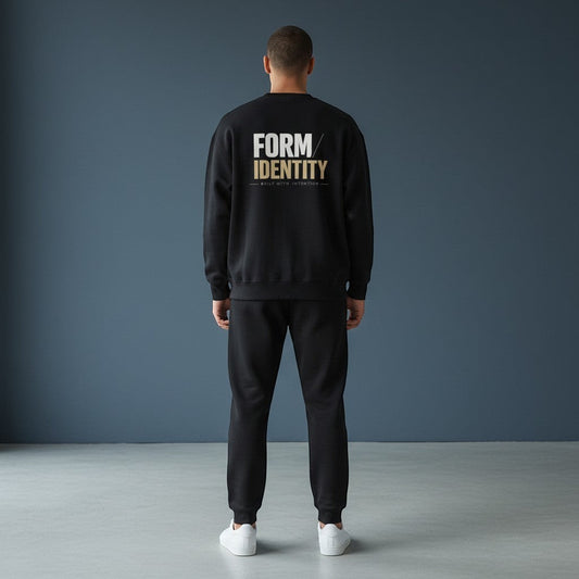 OMINA Studio black heavyweight cotton sweatshirt with oversized fit and brushed interior. Features drop shoulders and ribbed details.