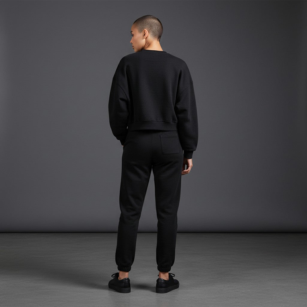 OMINA Studio black vintage washed cropped sweatshirt with drop shoulders and ribbed cuffs/hem.