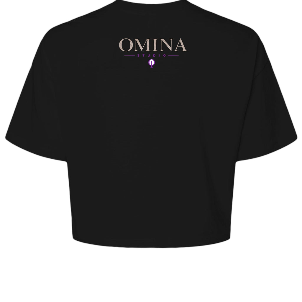 OMINA Studio black cropped heavyweight tee with "Move With Intention" typography and Medusa graphic on back.