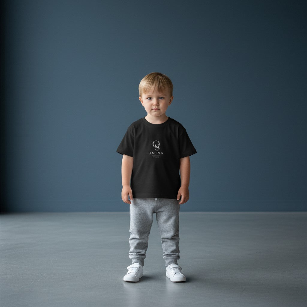 Omina Studio black infant t-shirt made from soft, breathable fine jersey cotton with a classic fit and minimalist logo.