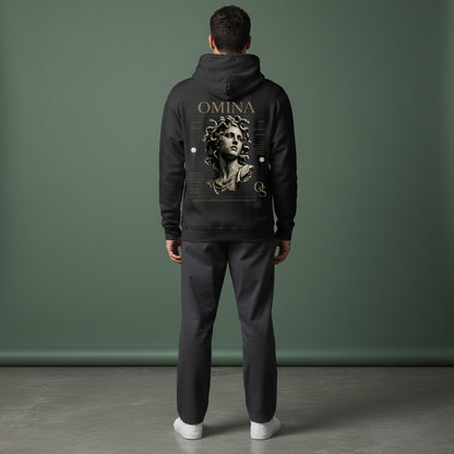 Omina Studio black cotton-blend hoodie with a large distressed Medusa graphic and "OMINA" text on the back.