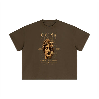 Omina Studio brown cotton boxy t-shirt with a faded statue face graphic and minimalist text.
