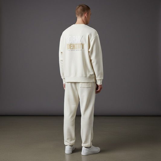 OMINA Studio heavyweight cotton sweatshirt in cream with oversized fit and graphic print on back.