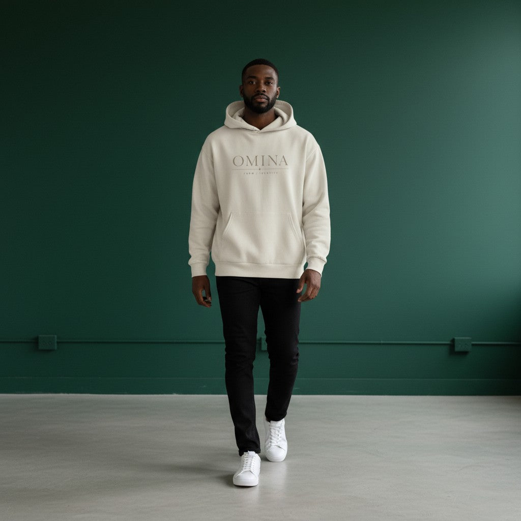 Omina Studio cream hoodie with 'OMINA FORM / IDENTITY' graphic print. Classic streetwear style.