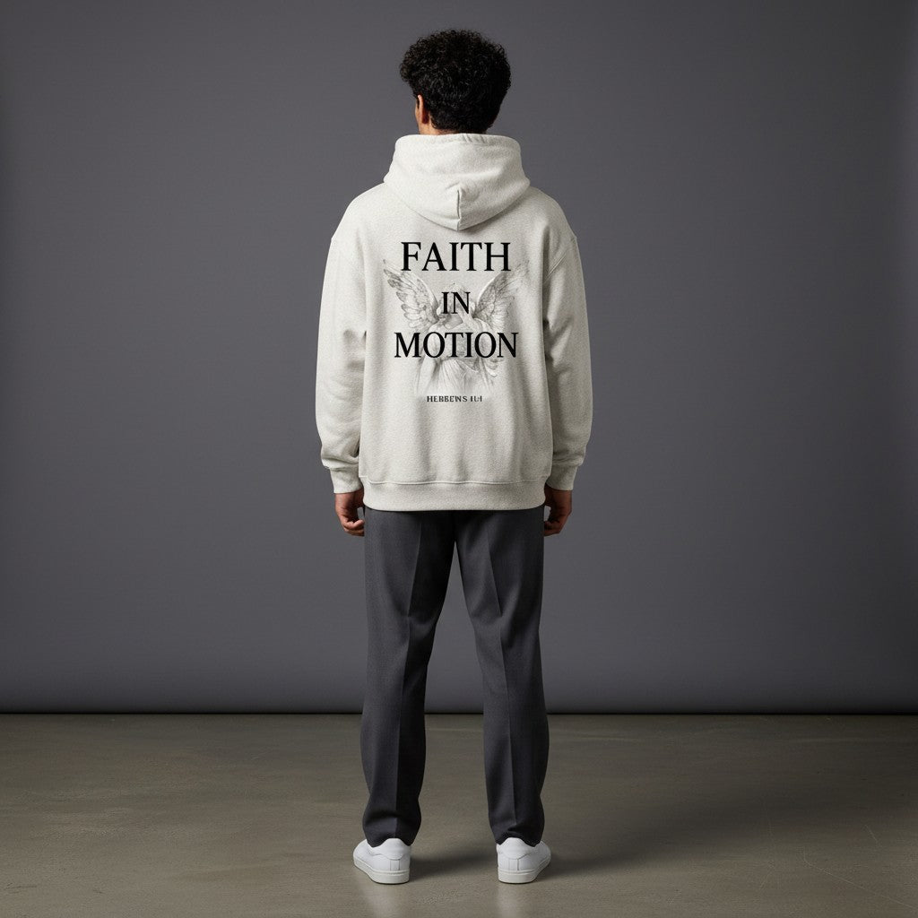 Omina Studio light heather grey heavyweight hoodie with "FAITH IN MOTION" text and angel graphic on back.