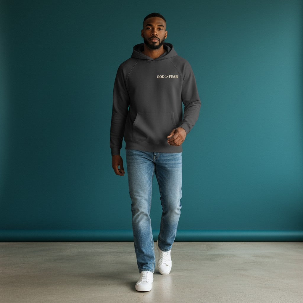 Omina Studio dark grey heavyweight cotton pullover hoodie with "GOD > FEAR" graphic on chest and front pocket.