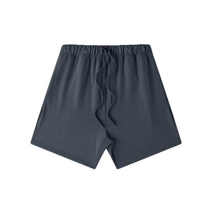 Omina Studio charcoal grey heavyweight French terry shorts with drawstring waist and subtle logo detail.