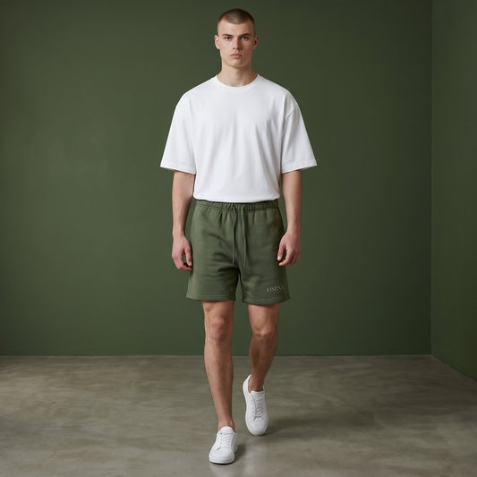 Omina Studio dark green heavyweight French terry shorts with elastic waist, drawstring, and side pockets. Oversized fit.