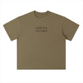 Omina Studio heavyweight cotton t-shirt in olive green with drop shoulders and a relaxed fit. Features a subtle logo.