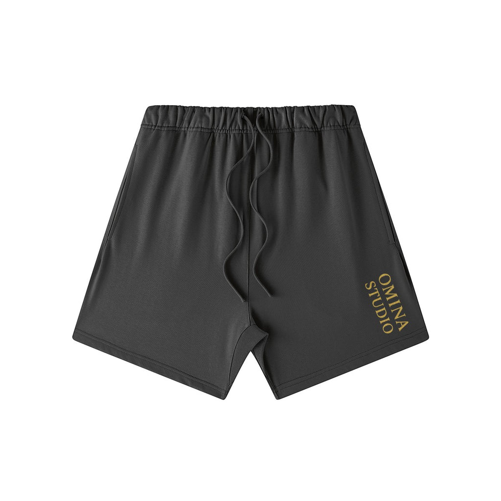 Omina Studio heavyweight charcoal French terry cotton shorts with elastic waistband and drawstring. Oversized fit.