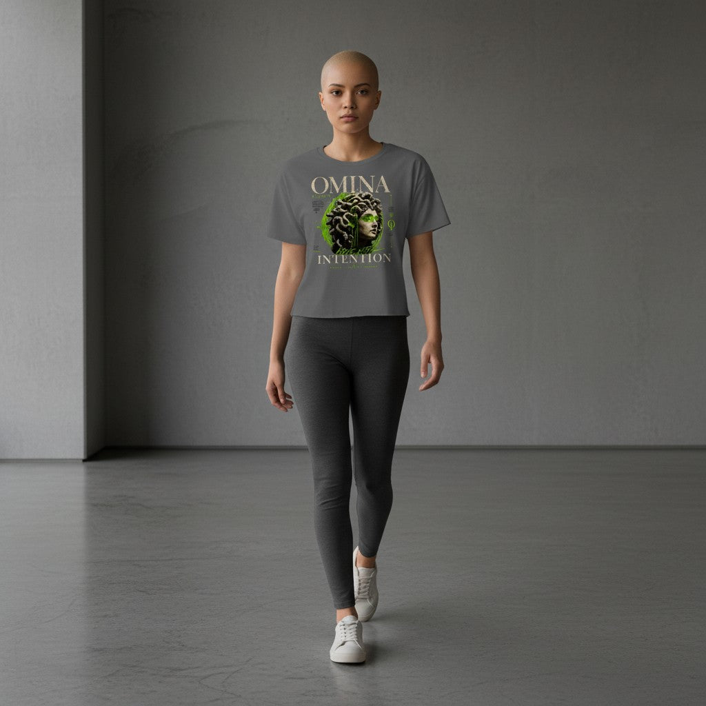 Omina Studio grey cropped t-shirt with Medusa bust graphic and "Move With Intention" text.