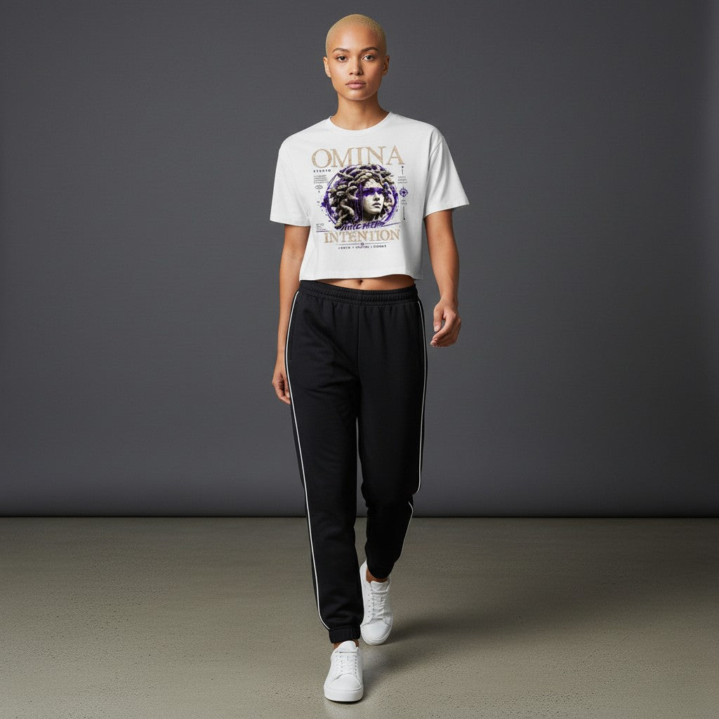 Omina Studio white cropped heavyweight tee with Medusa graphic and "Move With Intention" text.