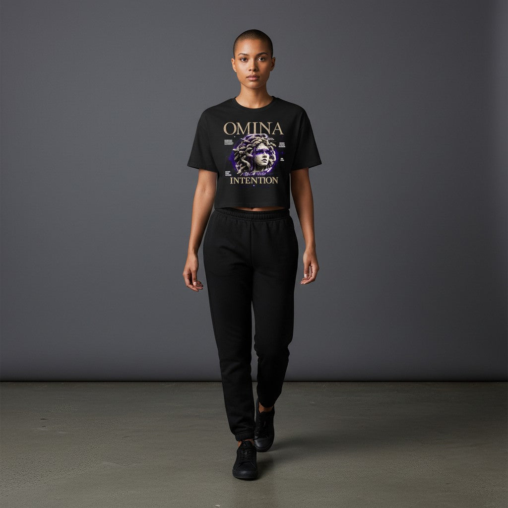 OMINA Studio black cropped heavyweight tee with Medusa graphic and "Move With Intention" text.