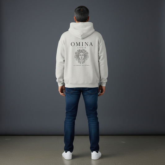 Omina Studio light grey heavyweight cotton hoodie with Medusa graphic and "All Things, All Within" text.