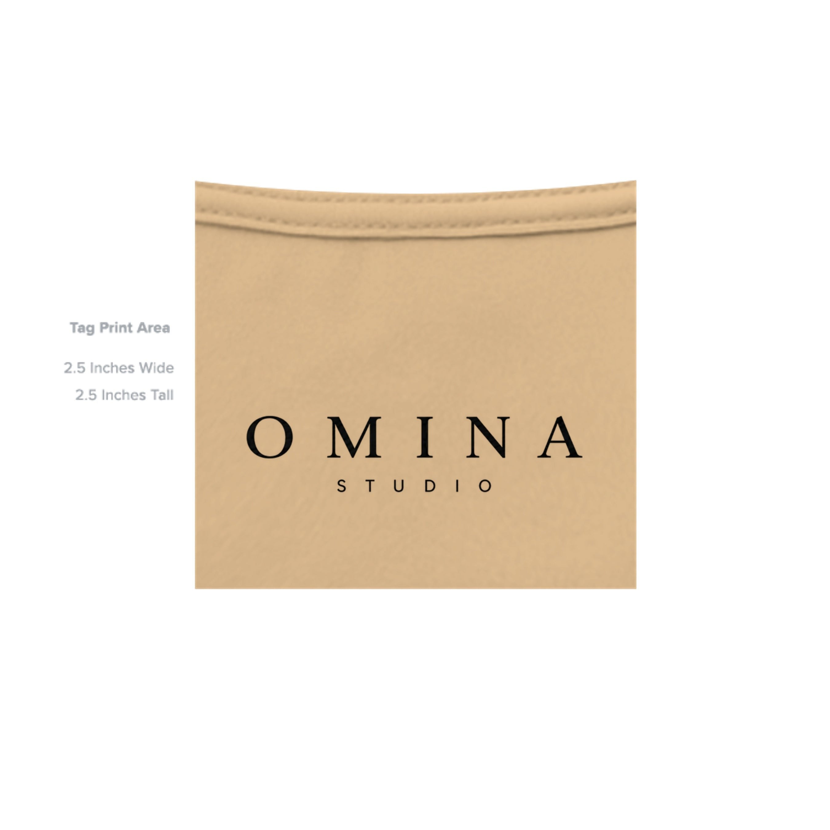OMINA Studio heavyweight cotton t-shirt in a light tan color with a vintage-inspired finish and signature graphic.