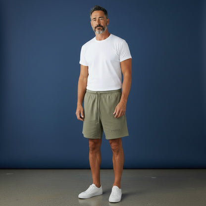 Omina Studio olive green relaxed fit athletic shorts with drawstring and subtle logo.