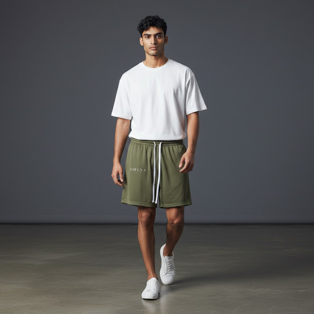 Omina Studio olive green mesh drawstring shorts with relaxed fit and minimal branding.