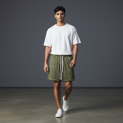 Omina Studio olive green mesh drawstring shorts with relaxed fit and minimal branding.