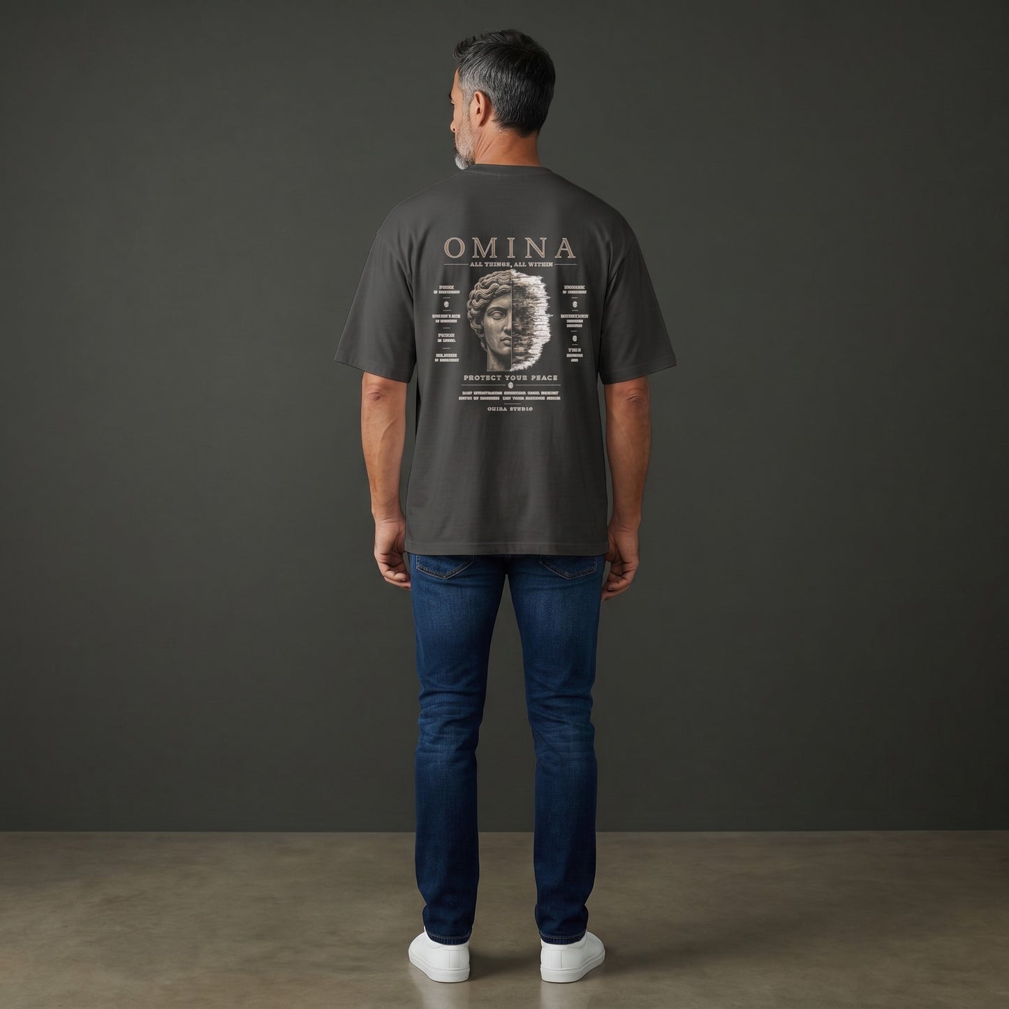 OMINA Studio dark grey heavyweight cotton t-shirt with 'Protect Your Peace' graphic on back.