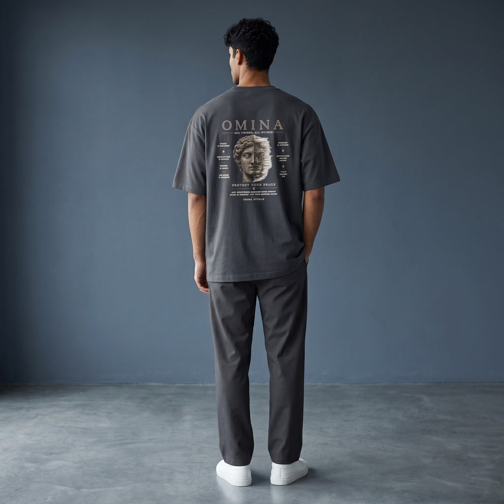 Omina Studio navy blue 100% cotton oversized fit crew neck t-shirt with "Protect Your Peace" graphic.