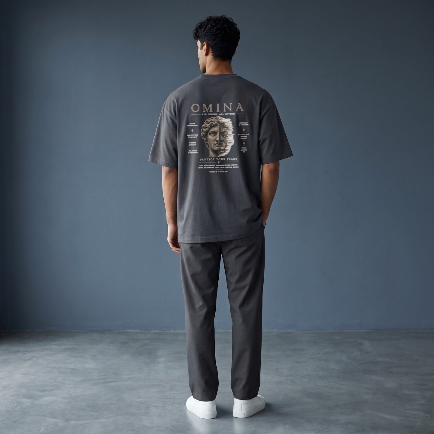 Omina Studio navy blue 100% cotton oversized fit crew neck t-shirt with "Protect Your Peace" graphic.