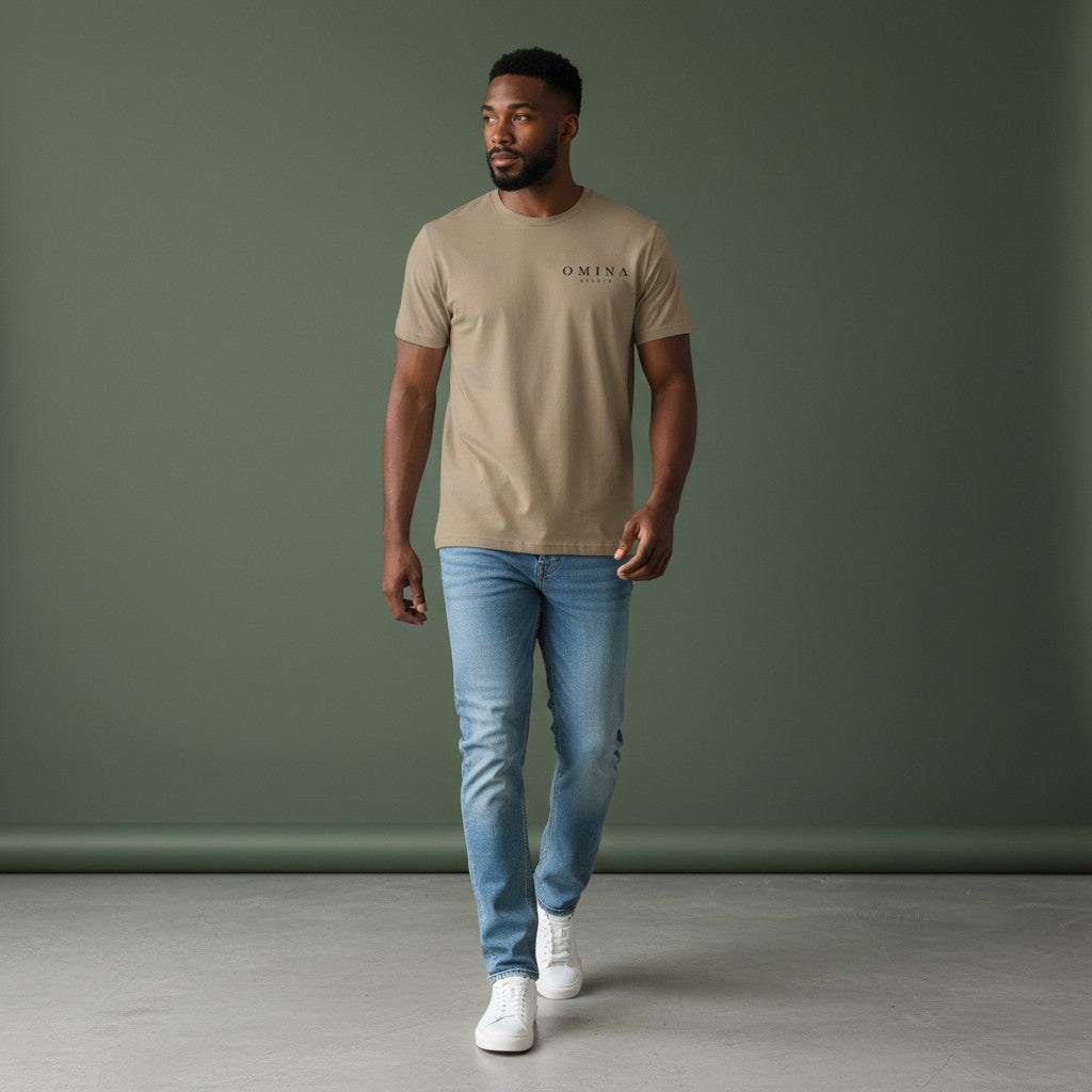 Omina Studio taupe heavyweight cotton t-shirt with subtle graphic logo on chest. Relaxed fit, vintage aesthetic.