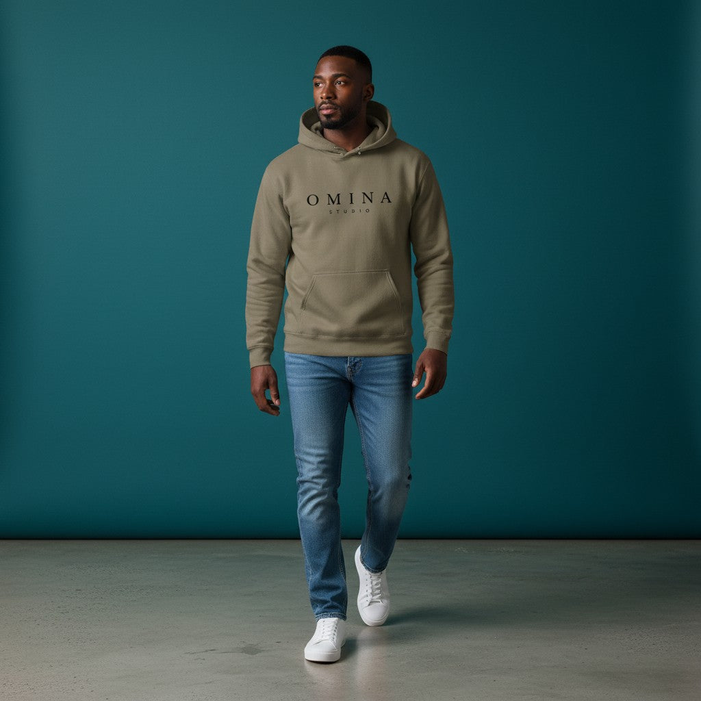 Omina Studio taupe pigment-dyed cotton blend hoodie with front logo and pouch pocket.