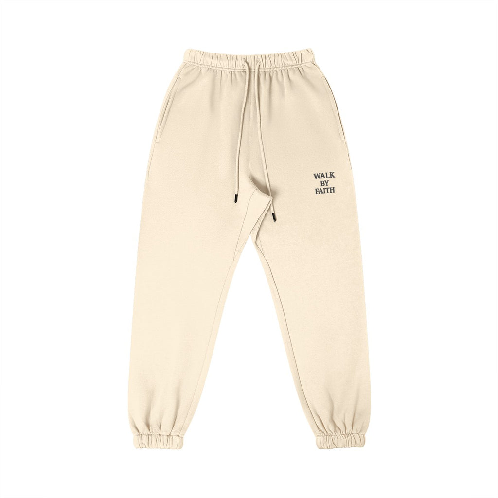 Omina Studio Walk By Faith cream heavyweight cotton sweatpants with tapered fit and drawstring.