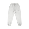 Omina Studio light grey cotton sweatpants with "Walk By Faith" text graphic on the right thigh.