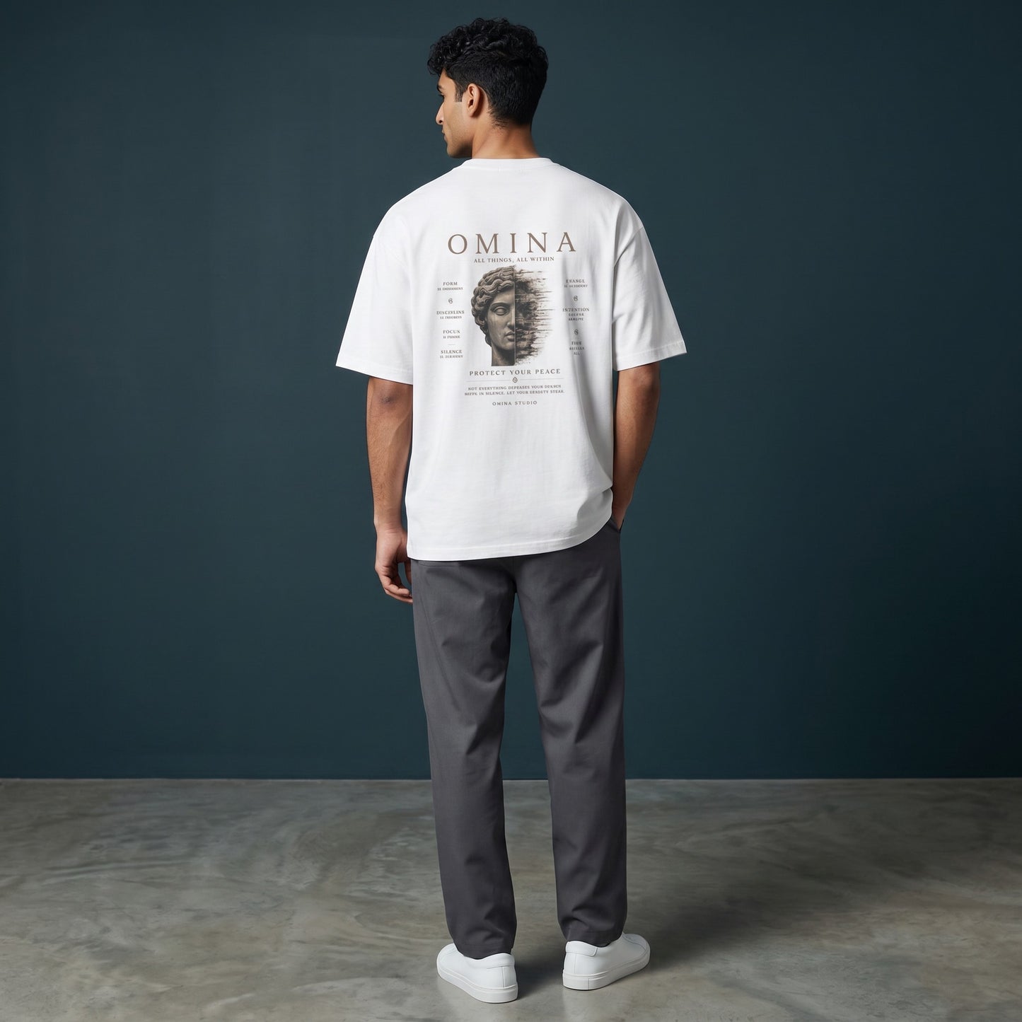 Omina Studio white 100% cotton oversized fit crew neck t-shirt with graphic print on back.