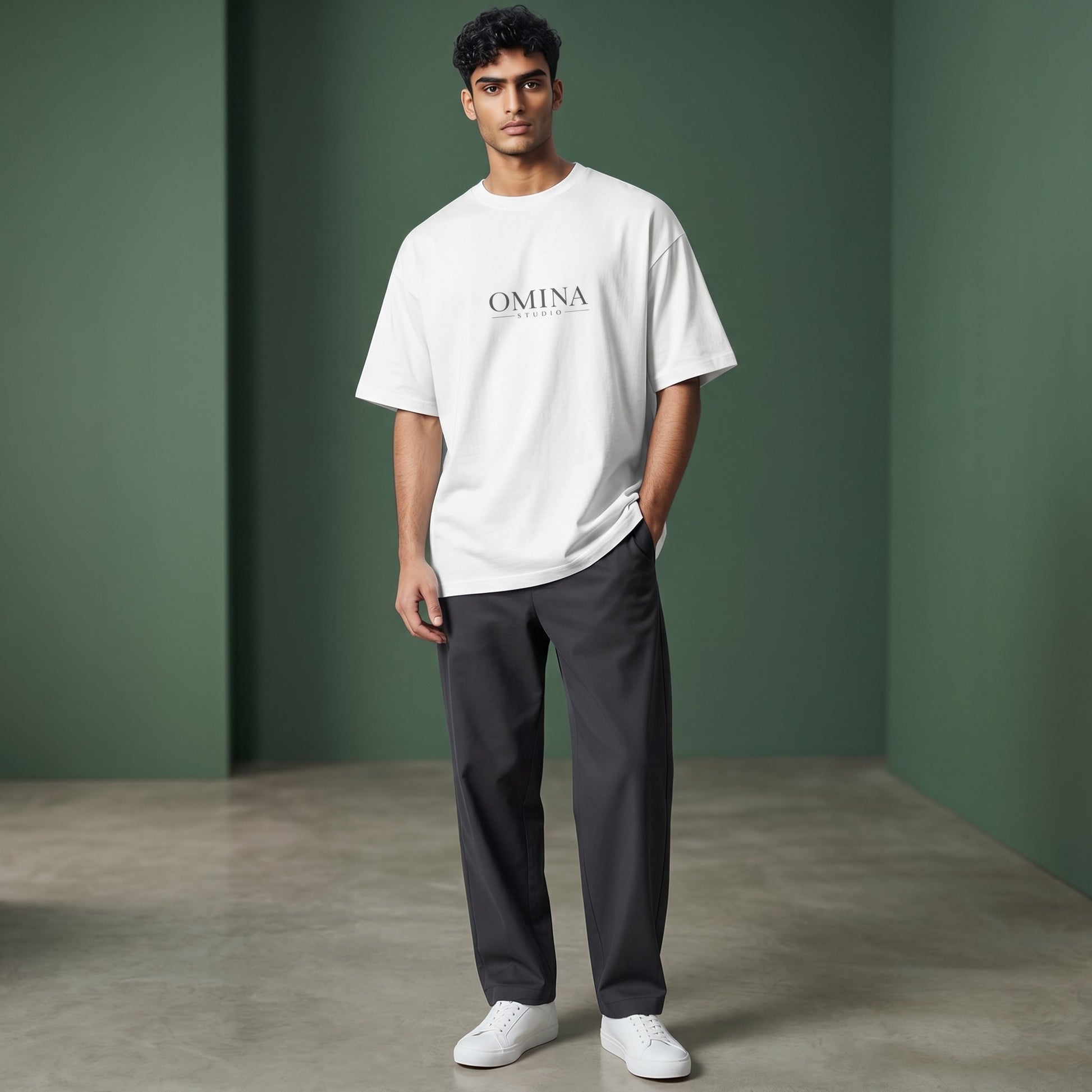 Omina Studio white 100% cotton oversized fit crew neck t-shirt with drop shoulders and minimalist logo.