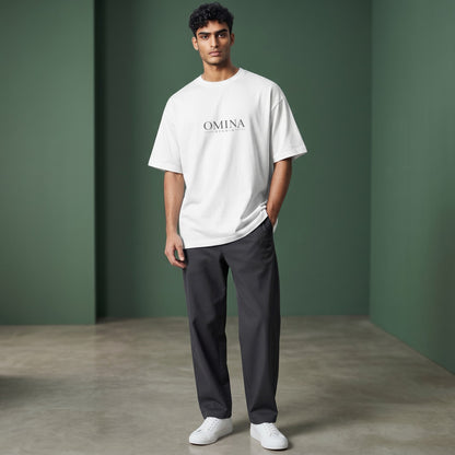 Omina Studio white 100% cotton oversized fit crew neck t-shirt with drop shoulders and minimalist logo.
