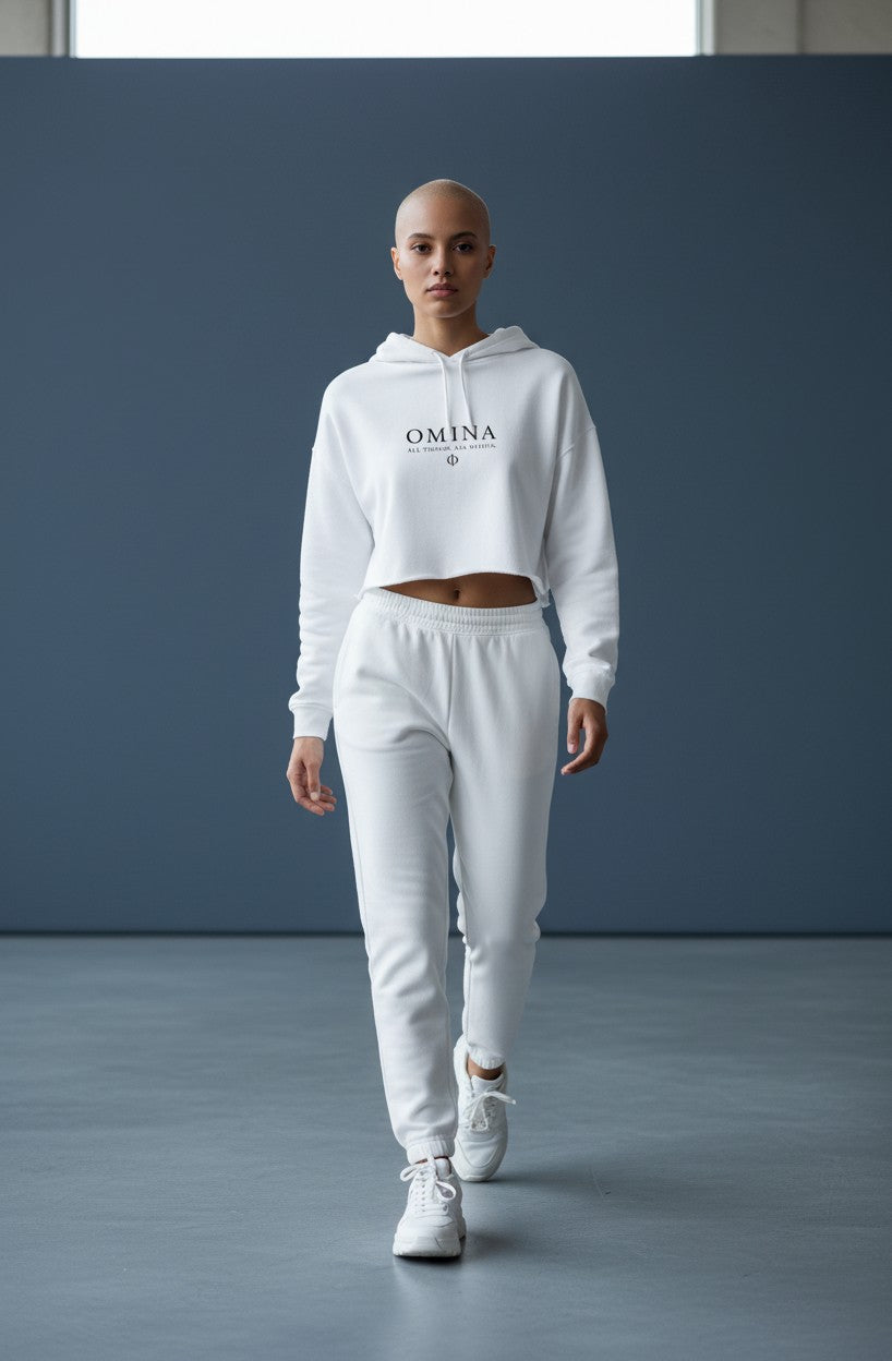 Omina Studio white lightweight cropped hoodie with adjustable drawstring hood and raw hem. Features Omina logo.