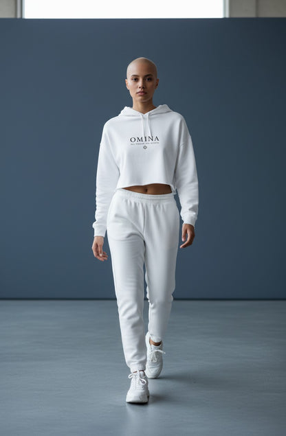 Omina Studio white lightweight cropped hoodie with adjustable drawstring hood and raw hem. Features Omina logo.