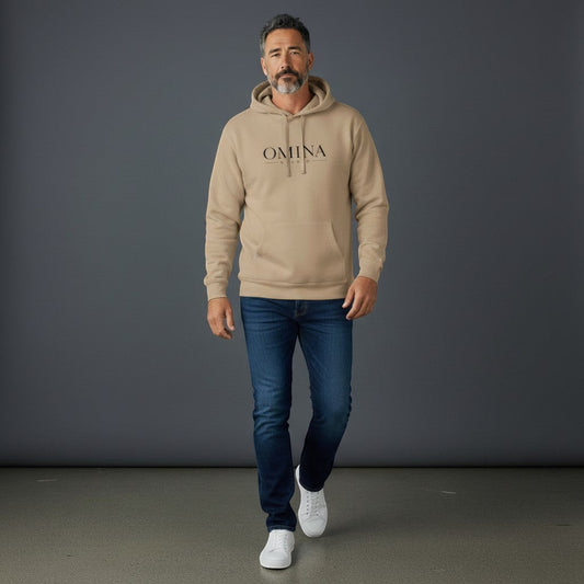 Omina Studio tan pigment-dyed cotton blend hoodie with front logo and relaxed fit, worn by a man.