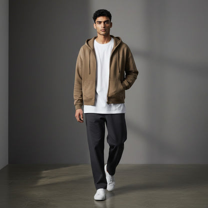 Omina Studio taupe distressed zip-up hoodie with faded graphic and raw hem details.