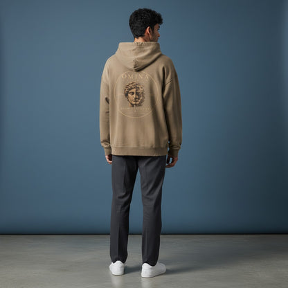 Omina Studio taupe cotton blend hoodie with faded graphic print of a split face and distressed details.