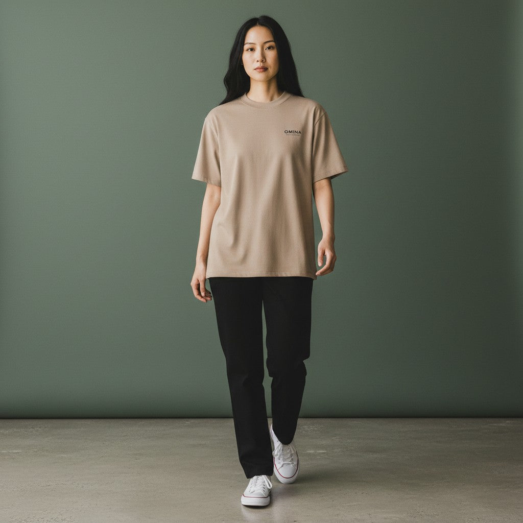 Omina taupe viscose and spandex blend short sleeve mock neck t-shirt with subtle logo detail.
