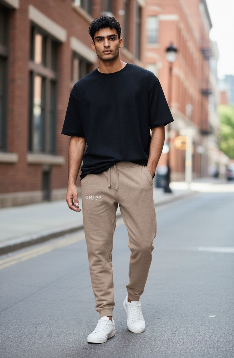Omina Studio unisex premium joggers in a light taupe color, made from soft cotton blend fabric.